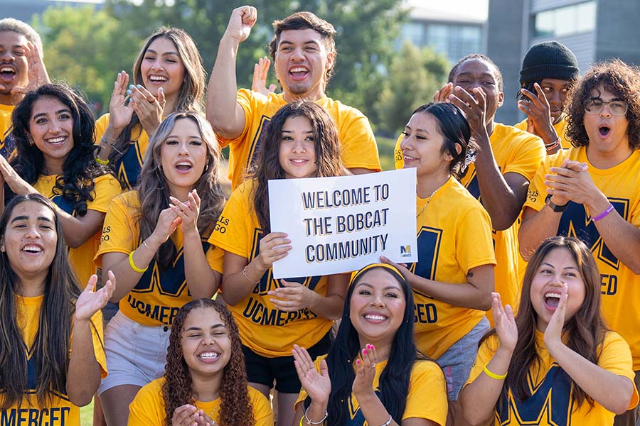 group of students chearing on uc merced students