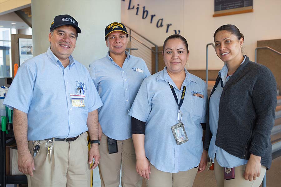 uc merced staff members working in the library